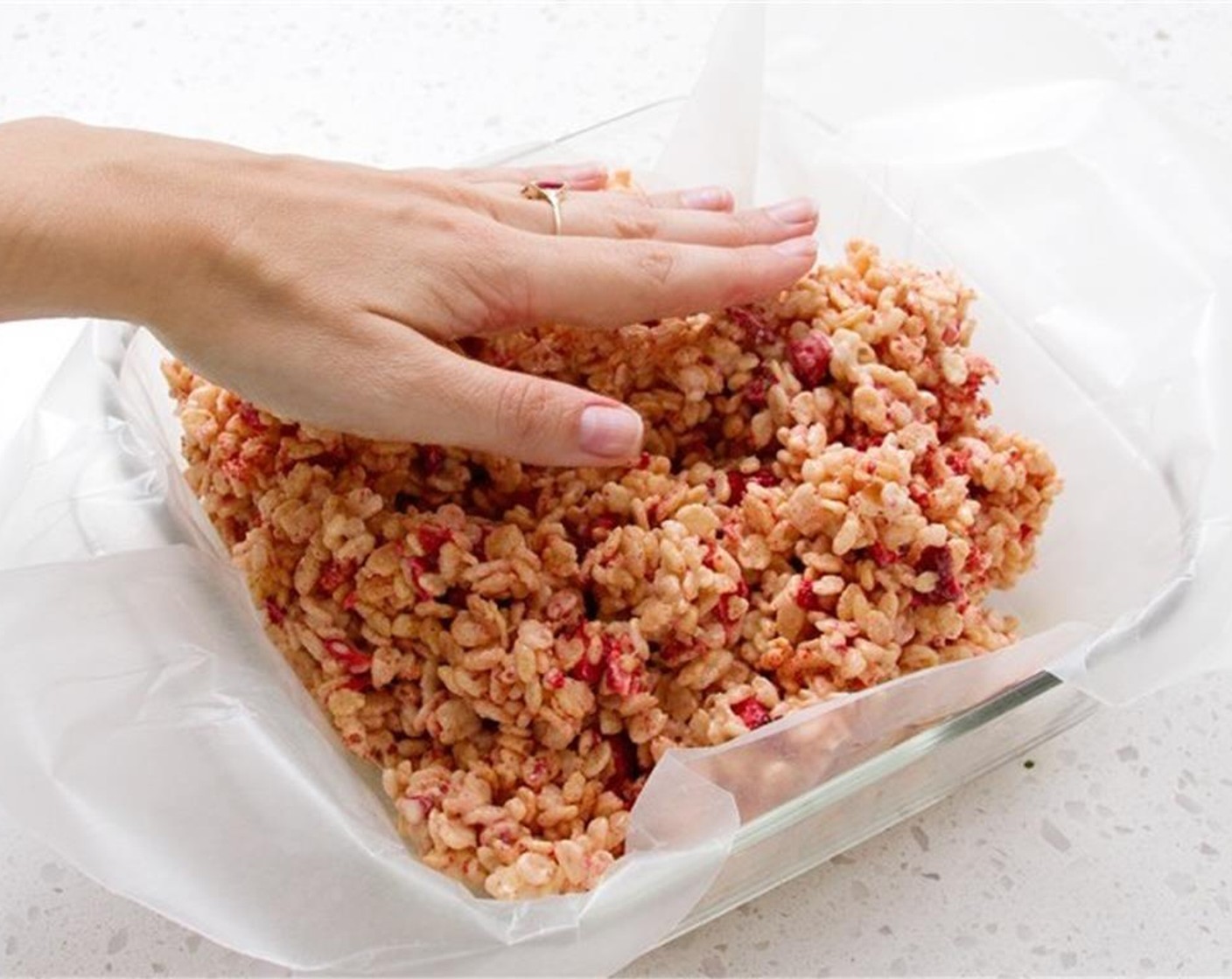step 4 Quickly grab a spoon or spatula, and spray with Nonstick Cooking Spray (as needed). Use to mix the rice krispie mixture until evenly coated. Pour into prepared pan, and press evenly. Refrigerate 30 minutes to let cool.