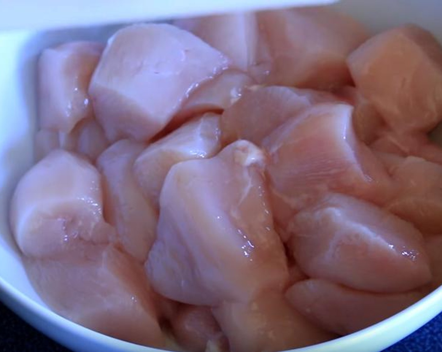 step 1 Cut Tyson® Chicken Breasts (2 lb) into pieces. Put them in a bowl.