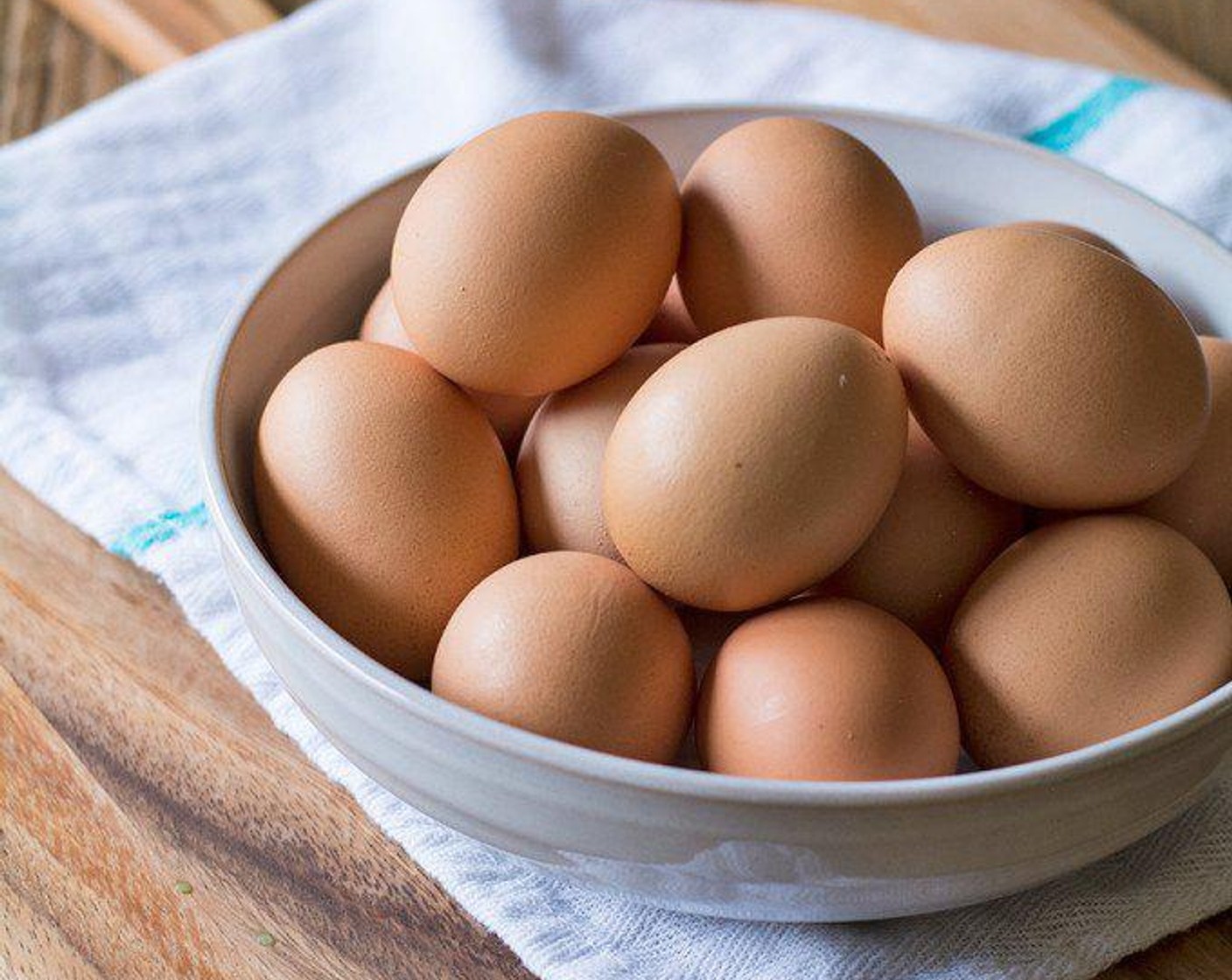 step 1 Lay a clean dish towel in pot and carefully add in the  Farmhouse Eggs® Large Brown Eggs (6). Fold the towel over the eggs and fill the pot with enough water to cover the eggs. Bring the water to a rolling boil, then remove from heat and leave the eggs in the pot of water until cooled.