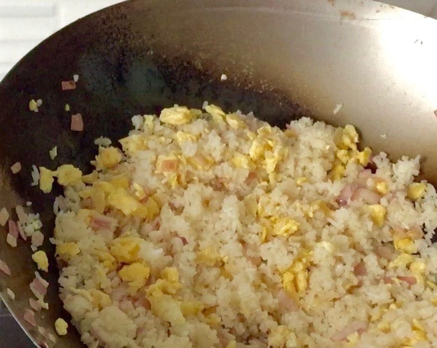 step 12 Keep stirring until the rice is evenly cooked and coated with eggs, about 2 minutes.