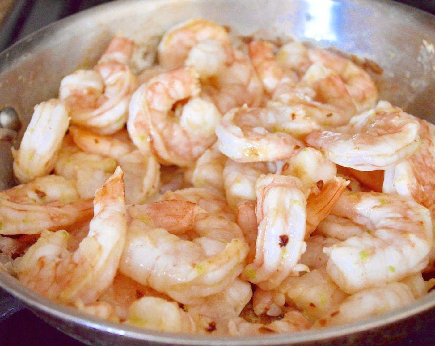 step 3 Get out a large skillet and heat the Coconut Oil (1 tsp) in it over medium high heat. Add the Shallot (1) and let them get soft for 30 seconds. Then add the Shrimp (1.5 lb) and Lime (1) and let the shrimp cook until opaque and pink for about 4-5 minutes.