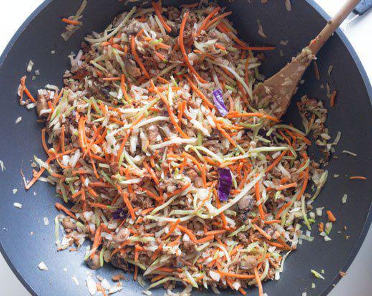 step 2 Add Green Cabbage (1 pckg), Carrot (1/2 pckg) and Broccoli Slaw (1 pckg), Soy Sauce (2 Tbsp) or teriyaki sauce and Toasted Sesame Oil (1 Tbsp) and stir. Add more oil if needed. Cover and cook for a couple minutes.