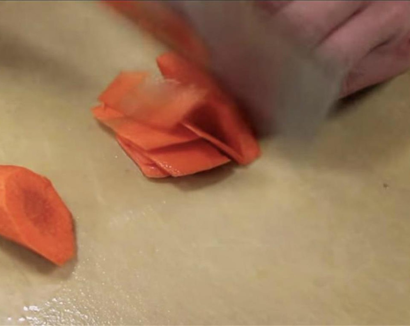 step 3 Slice the Carrot (1/4) into thin slices at a 45 degree angle.