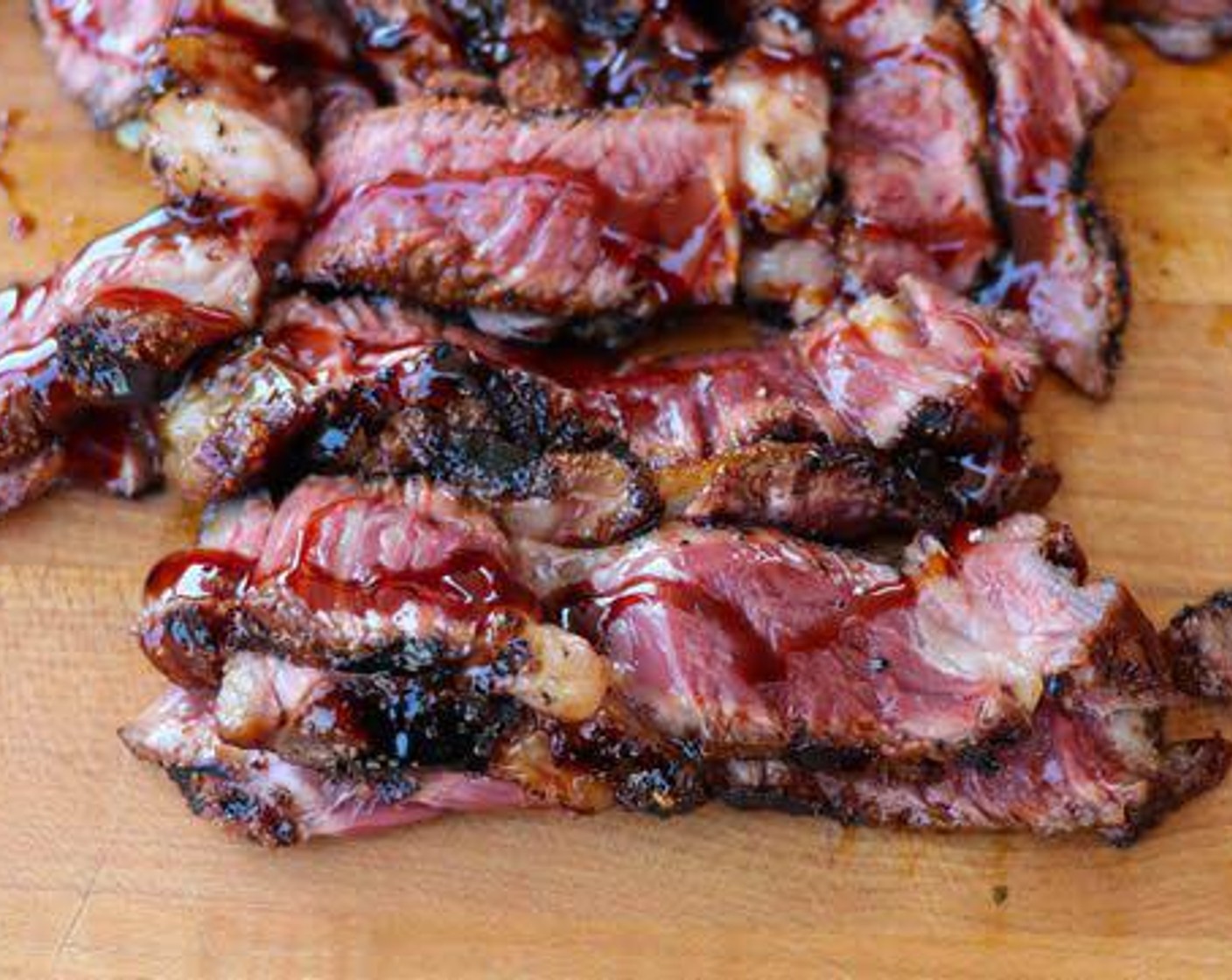 step 4 Slice ribeyes as thin and toss sliced meat with remaining Unagi Sauce (1 Tbsp).