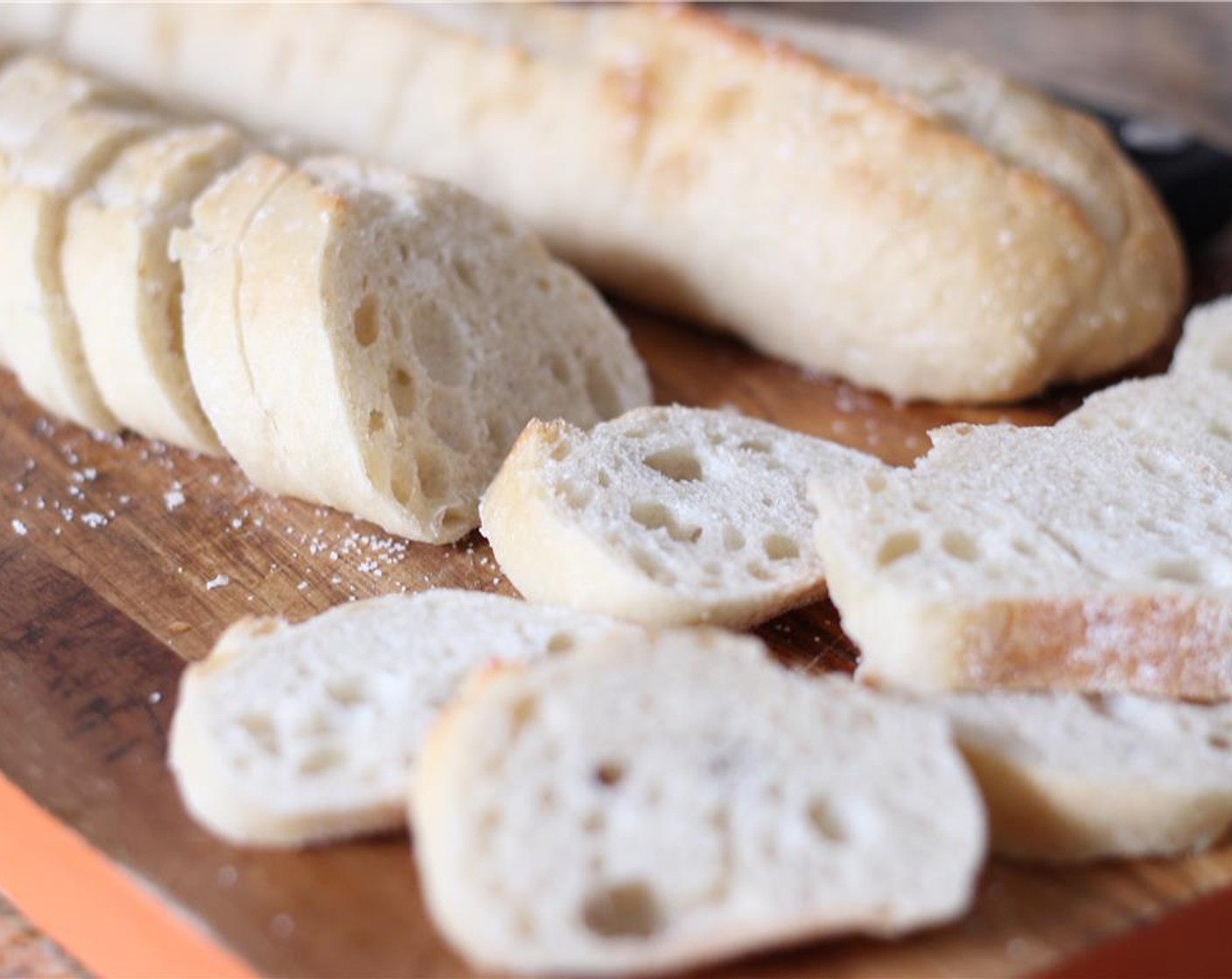 step 2 Slice the Baguette (1) into rounds. Brush the bread slices with Extra-Virgin Olive Oil (2 Tbsp).