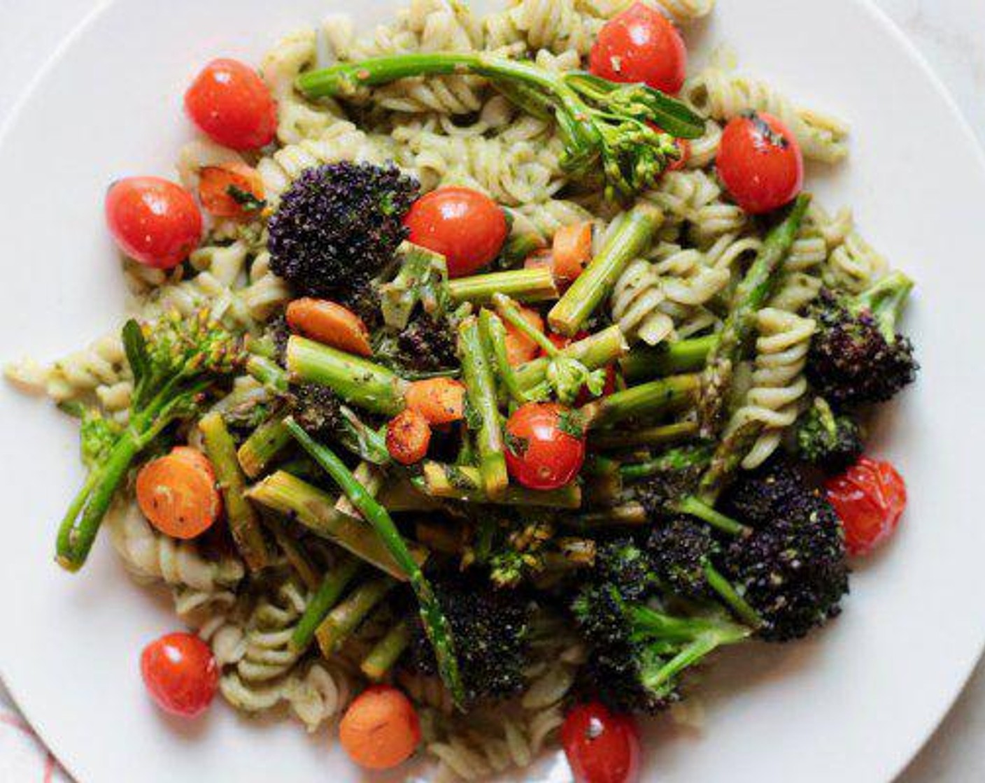 step 4 Remove from heat. Pour Kale Pesto (1 cup) over your Fusilli Pasta (1 lb) and mix well. Pour the veggie mix from the pan over the pesto pasta and still well. Serve and enjoy!