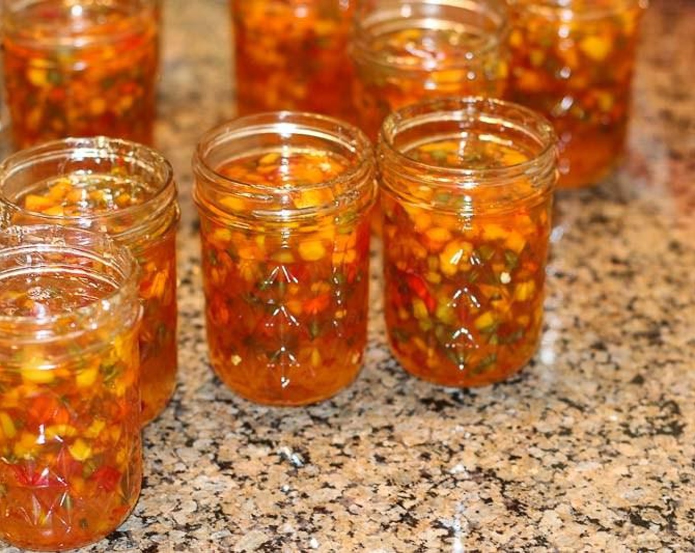 step 4 Ladle jelly evenly into sterile jars, filling to 1/4 inch from top of jar. Cover with flat lids and screw on screw bands tight.