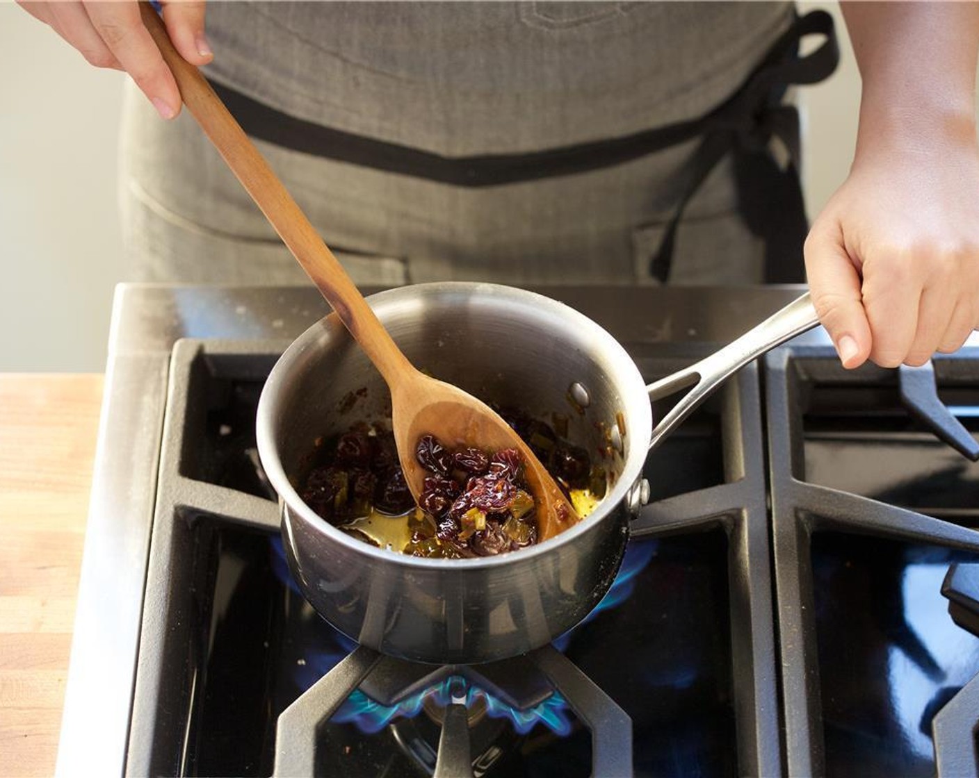 step 4 In a small saucepan over medium heat, add Olive Oil (2 Tbsp), Scallions, Red Wine Vinegar (1 Tbsp), Ground Black Pepper (1/4 tsp), and Salt (to taste). Stir and bring to a simmer. Add Dried Cherry (1/2 cup), Crushed Red Pepper Flakes (1/2 tsp), and boil.