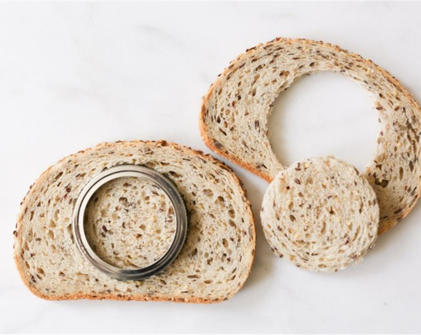 step 2 Using a cookie/biscuit cutter or mason jar lid, remove a circle (ideally 2-3 inches in diameter) of Bread (2 slices) from each slice.