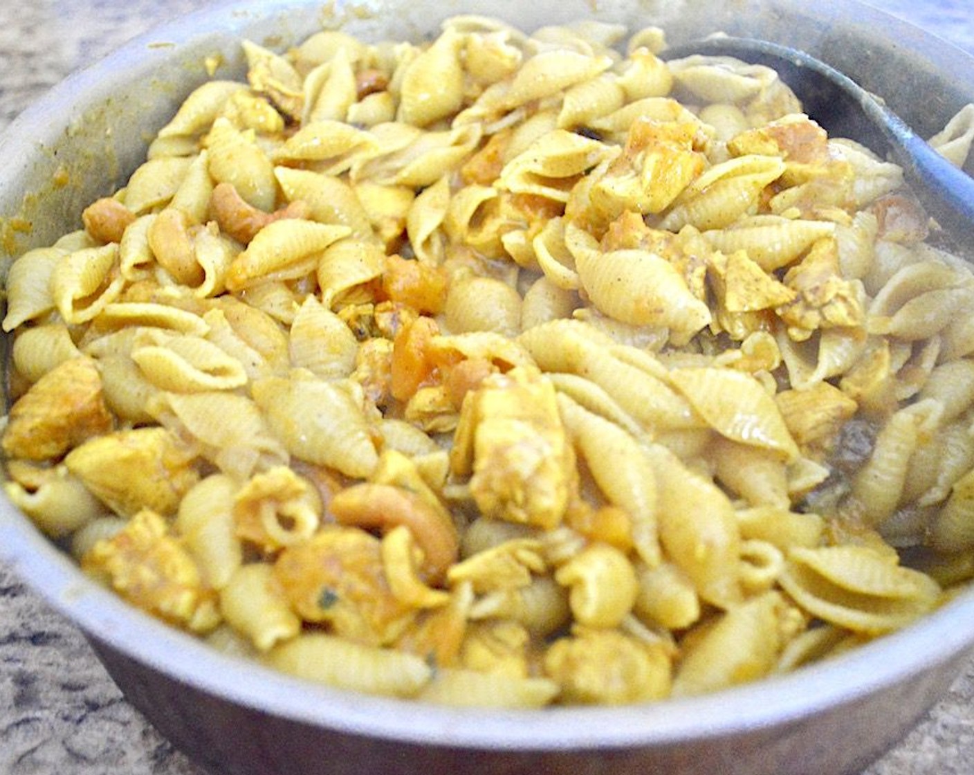 step 9 Stir the cooked pasta gently into the sauce until the shells are coated.