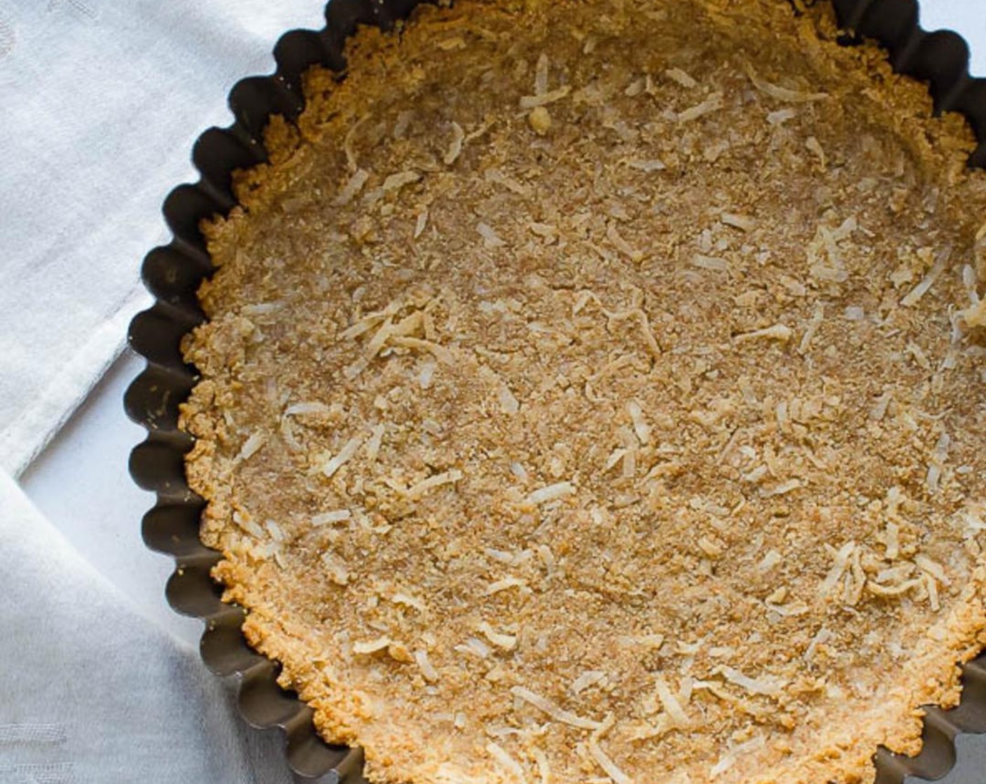 step 3 Pour the crumbs into an 8" tart pan with removable bottom. Press the crumbs into the bottom and sides of the pan. Bake for 8-10 minutes or until browned. Set aside to cool completely.