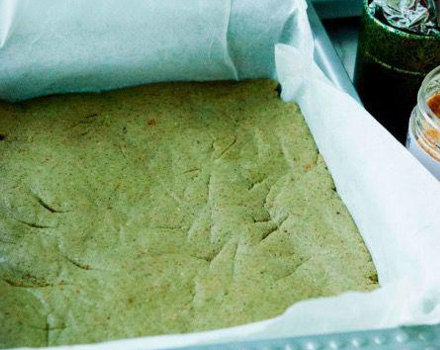 step 2 Spread it into a baking tray layered with parchment paper and refrigerate for 8 hours, or overnight.