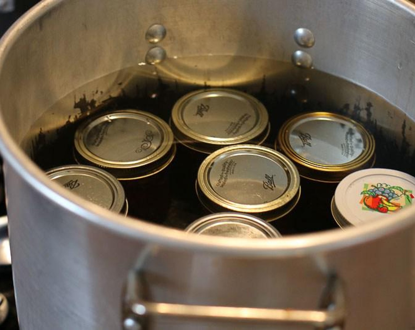 step 5 Place jars into canner with hot water that is not boiling. Water should completely cover jar. Cook on high heat to reach a boil. Process for 5 minutes.