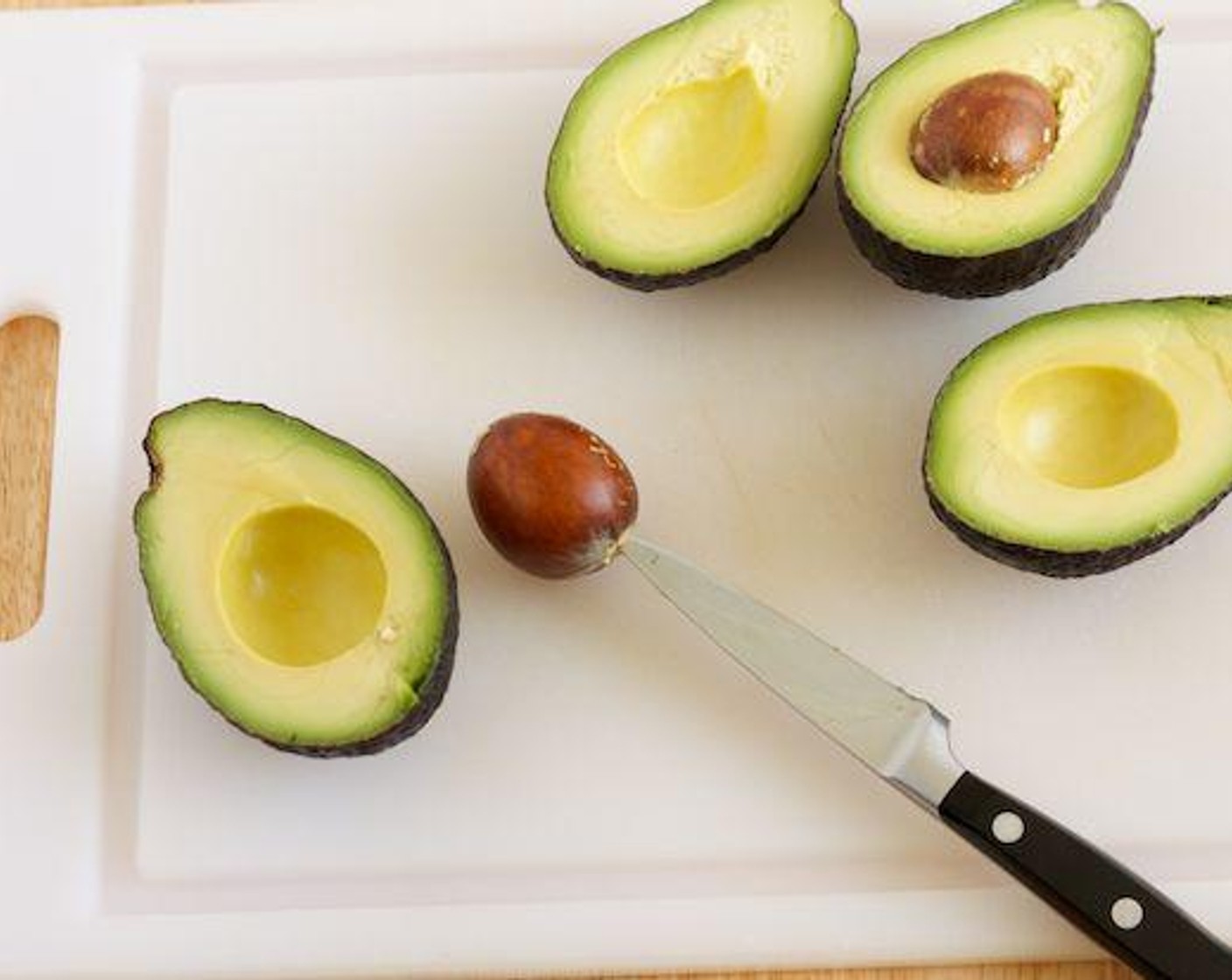 step 1 To prepare the guacamole, remove the Avocados (2) pits and skins. Place in a bowl big enough for mashing.