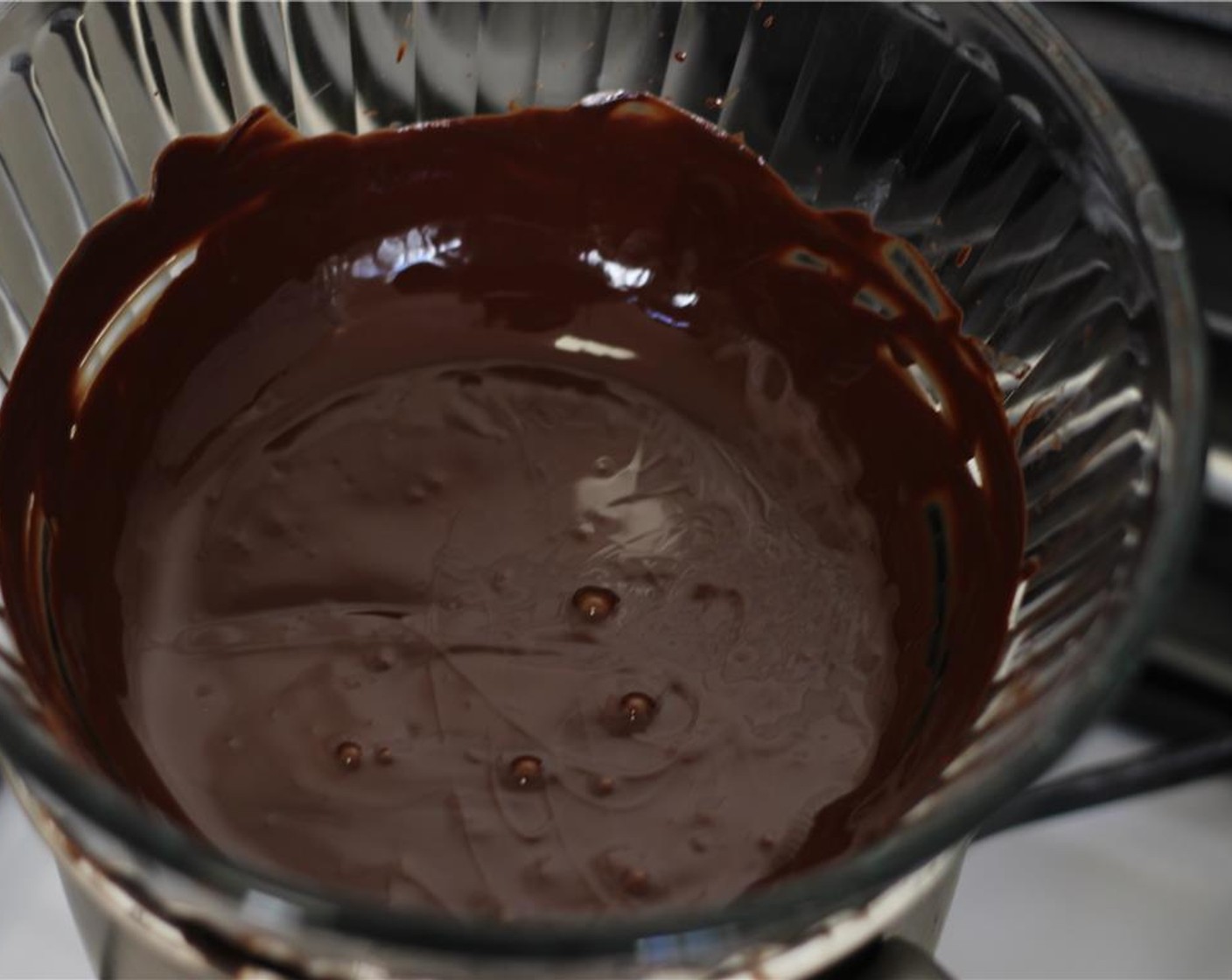 step 3 In a double boiler, melt the dark chocolate and Unsalted Butter (2/3 cup).
