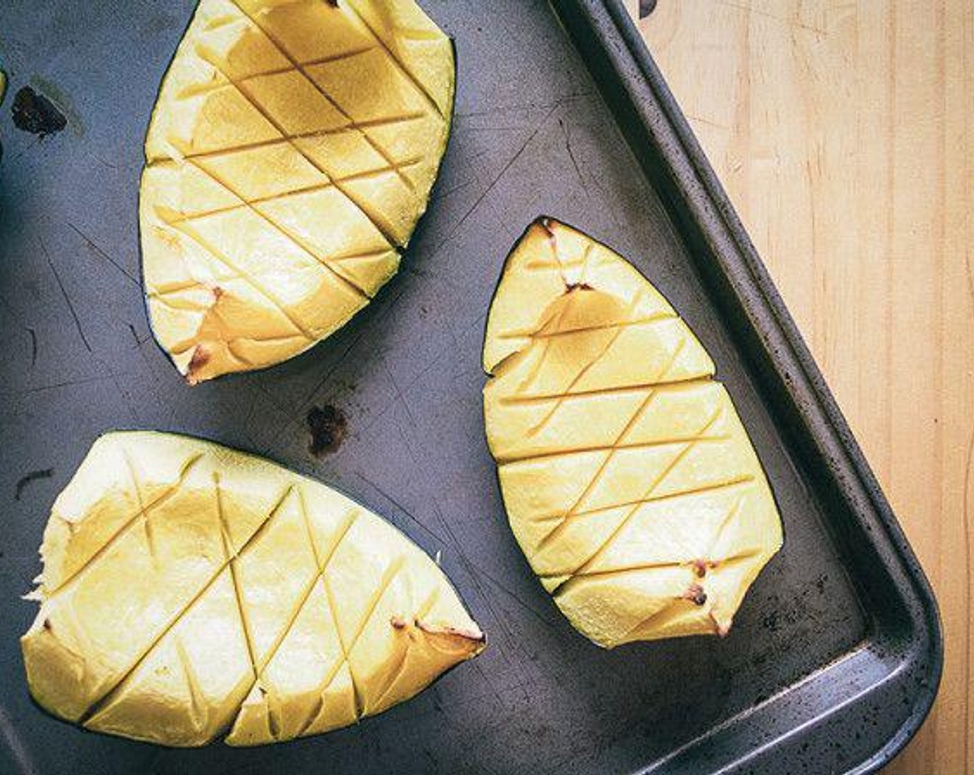 step 2 Cut the Acorn Squash (1) into quarters then use a knife to slice cross pattern cuts into flesh and bake for approximately 20 to 25 minutes or until flesh is tender.