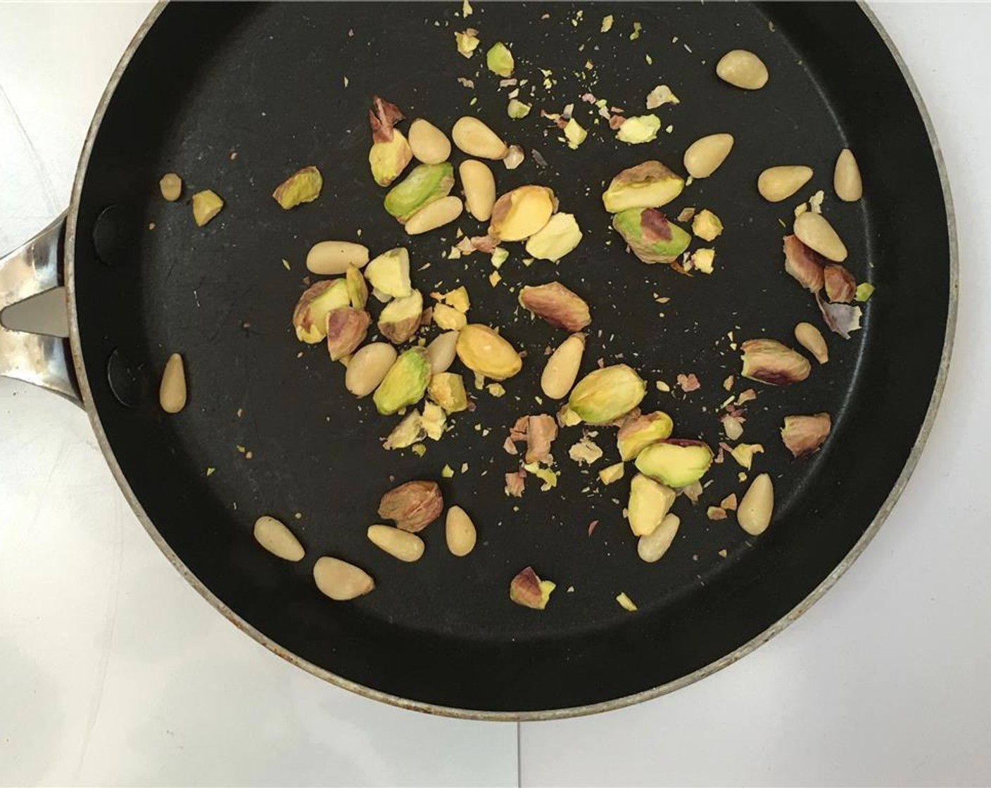 step 6 In the meantime, roughly crush the Pistachios (1 handful) and lightly toast them over medium heat for 3 to 4 minutes while tossing them regularly.