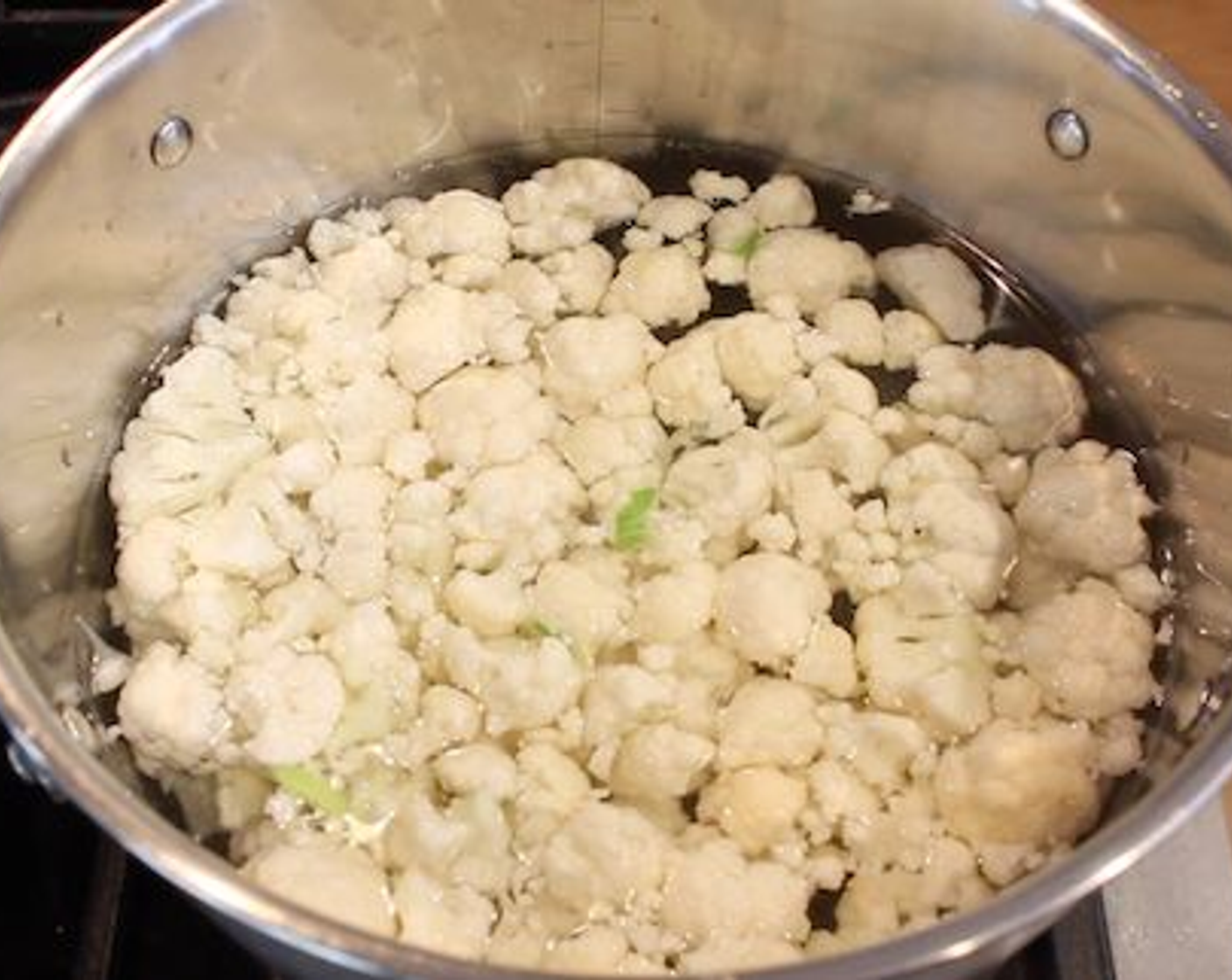 step 2 While the bacon is cooking, into a pot with boiling Water (4 cups) with Salt (1 tsp) add in your Cauliflower (1 head). Cook it until just tender, don’t overcook otherwise they get waterlogged and mushy.