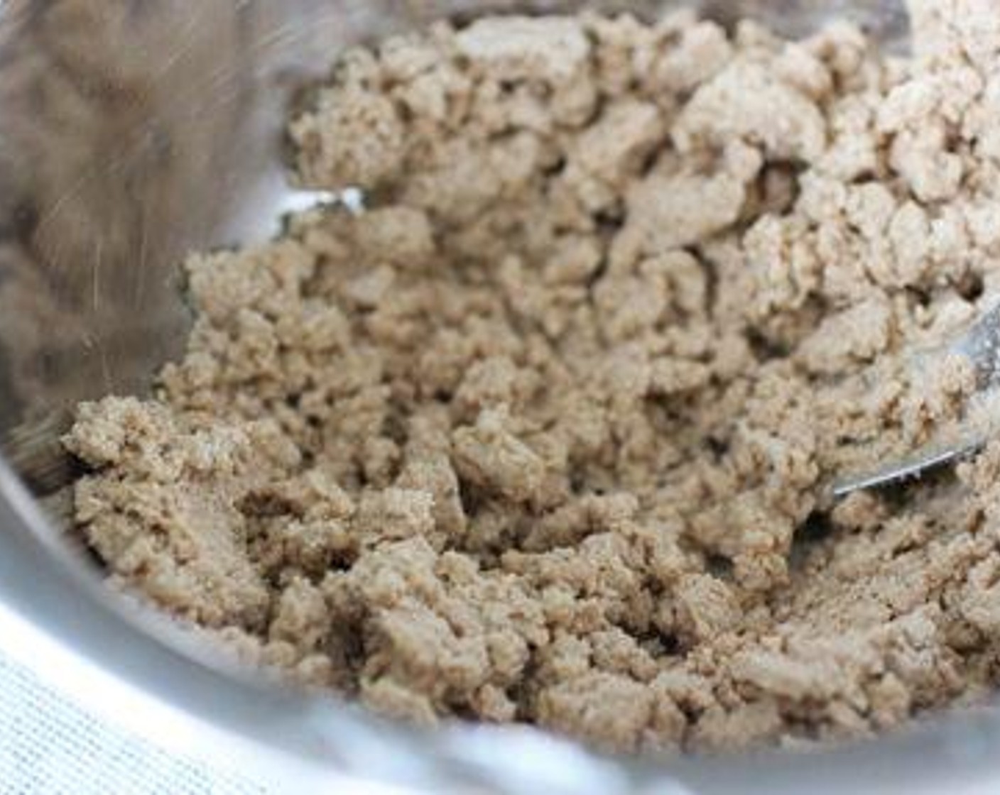 step 3 Place the Whole Wheat Flour (2 cups) and Vegetable Shortening (2/3 cup) in a large bowl, and cut together with a fork until it forms pea-sized chunks. Add Water (3 Tbsp), one tablespoon at a time, while mixing.