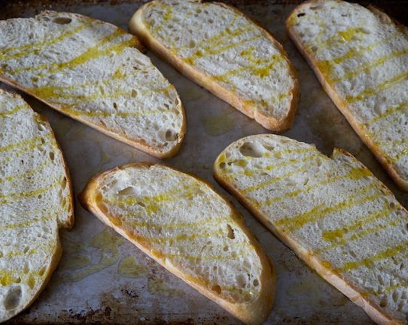 step 3 Place the bread under the broiler until golden brown. This happens very quickly! Don’t walk away. It’s best to leave the oven door cracked open, and monitor closely. When bread has browned on one side, flip it over, and repeat on the other side.