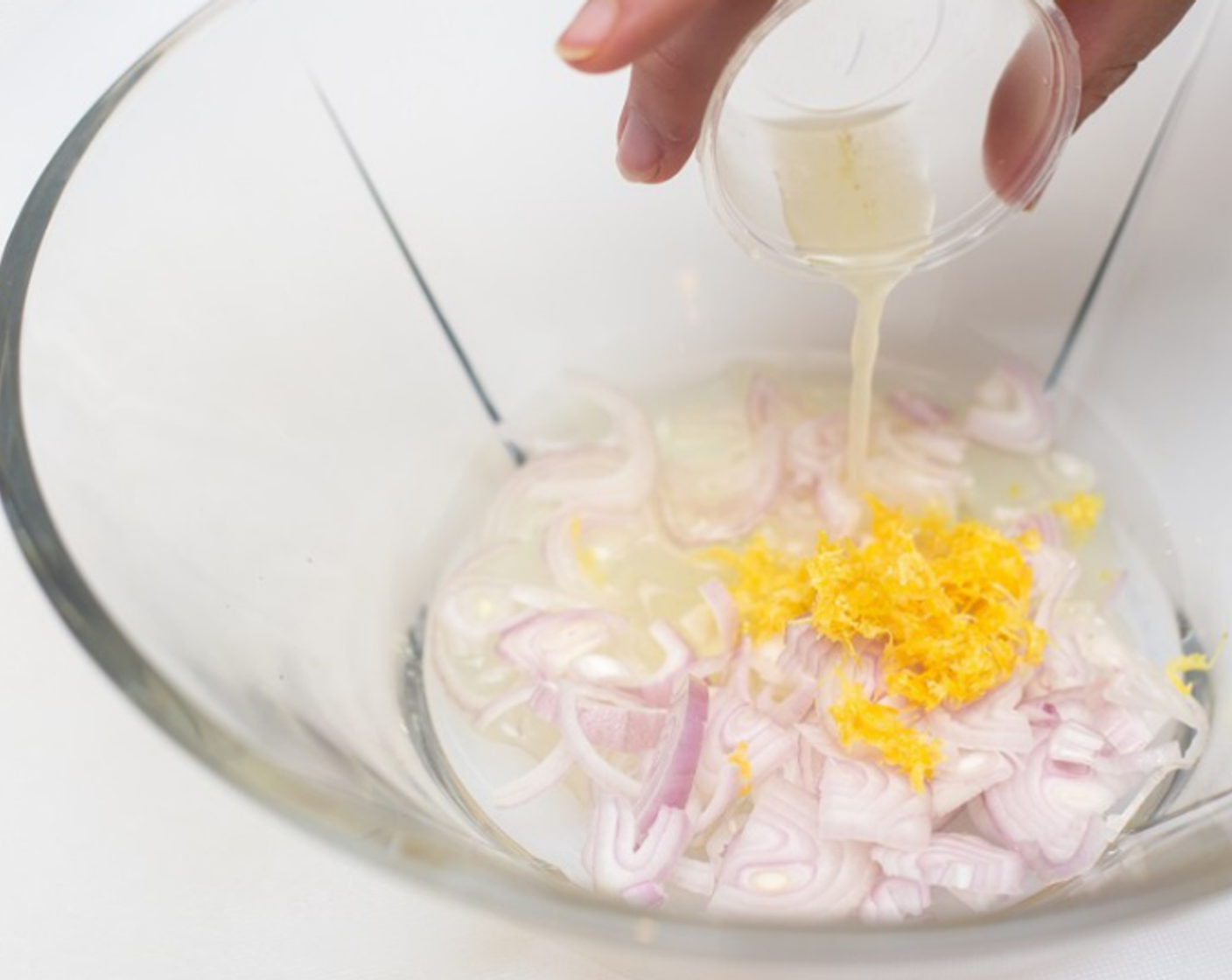 step 5 In a large mixing bowl combine Shallots (to taste), lemon zest, 1/2 tsp lemon juice, Olive Oil (1 Tbsp), Kosher Salt (1/2 tsp), and Ground Black Pepper (1/4 tsp). Whisk well.