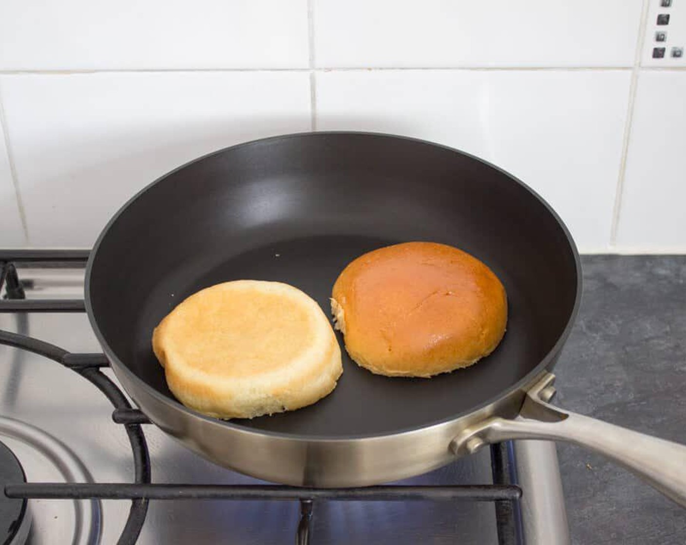 step 3 Heat another frying pan over a medium heat & place the Brioche (2) face down. Leave for a few minutes, checking regularly, until nice and golden then transfer to serving plates.