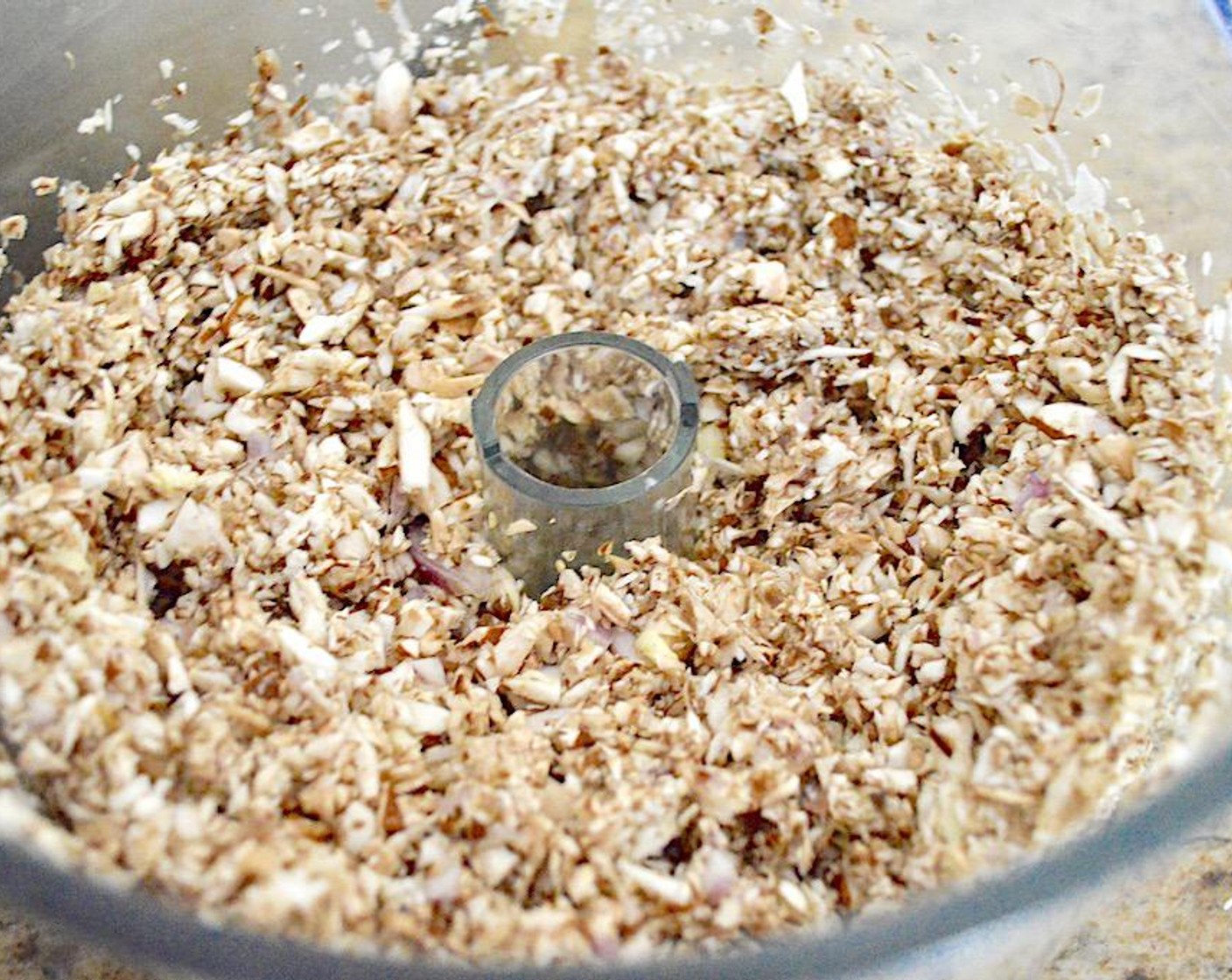 step 1 First, make the duxelles. Combine the Cremini Mushrooms (4 1/2 cups), Shallot (1), and Garlic (3 cloves) in a food processor and pulse it all together until it is a fine mixture. Set it aside.