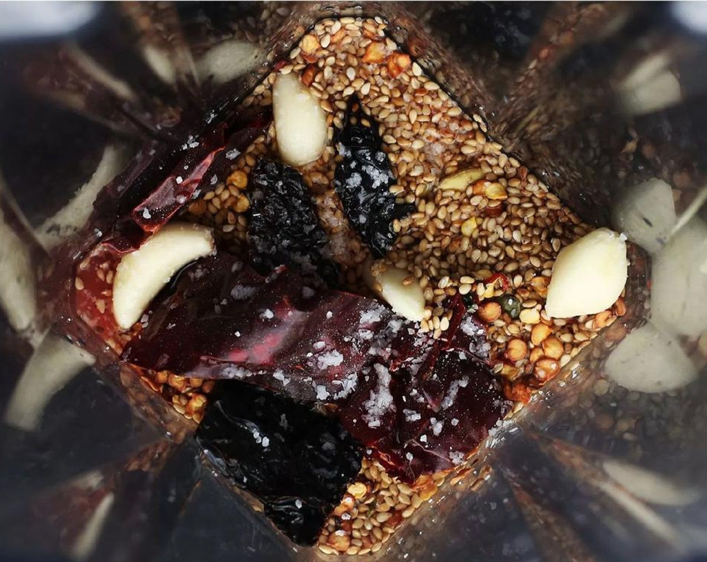 step 4 Toast the White Sesame Seeds (1/2 cup), Pepitas (2 Tbsp), Annatto Seeds (1 Tbsp), and Peppercorns (1/2 Tbsp) in a small saucepan until just fragrant and add to a blender container.