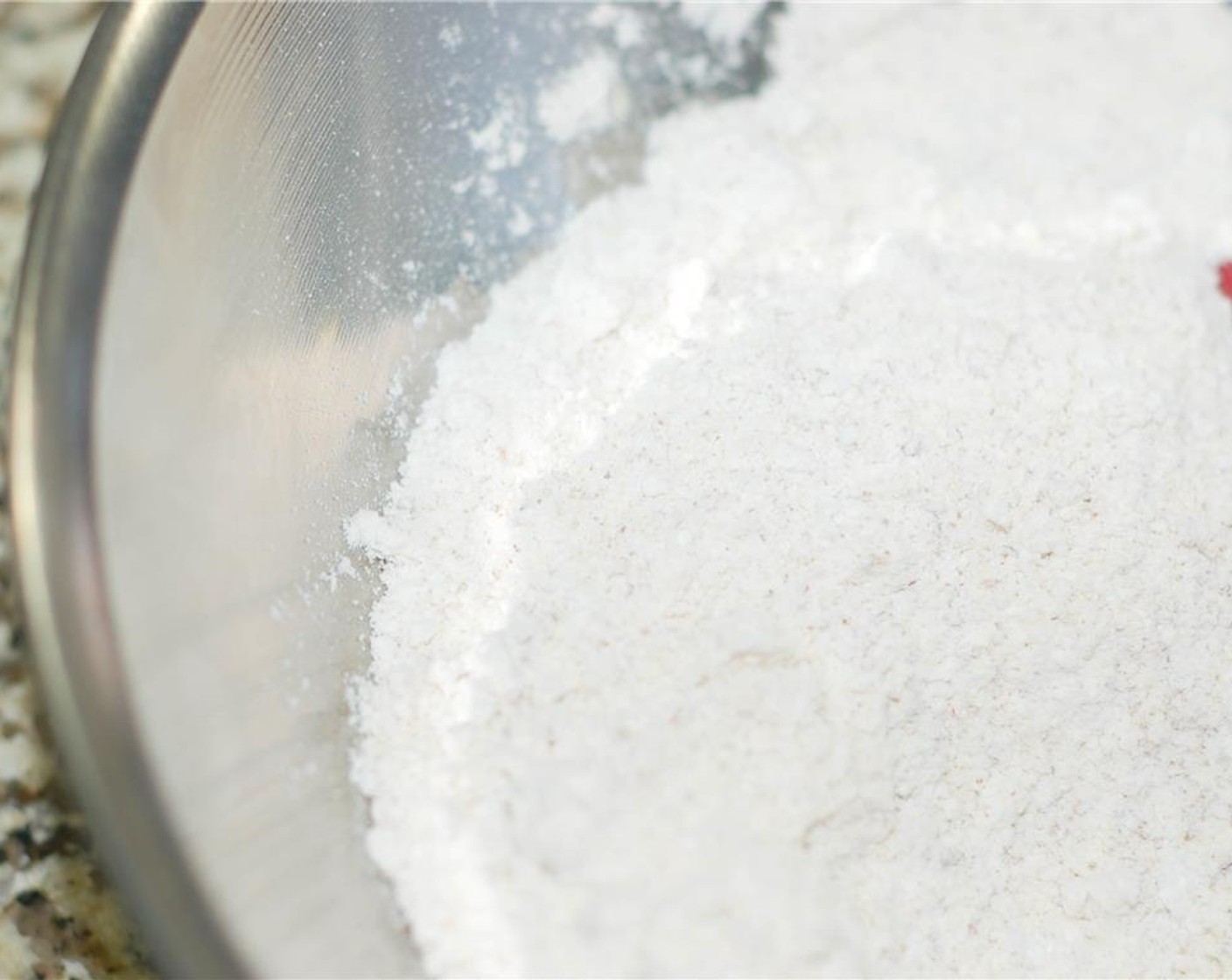step 4 In a large bowl, combine the hazelnut flour mixture and the sifted powdered sugar.