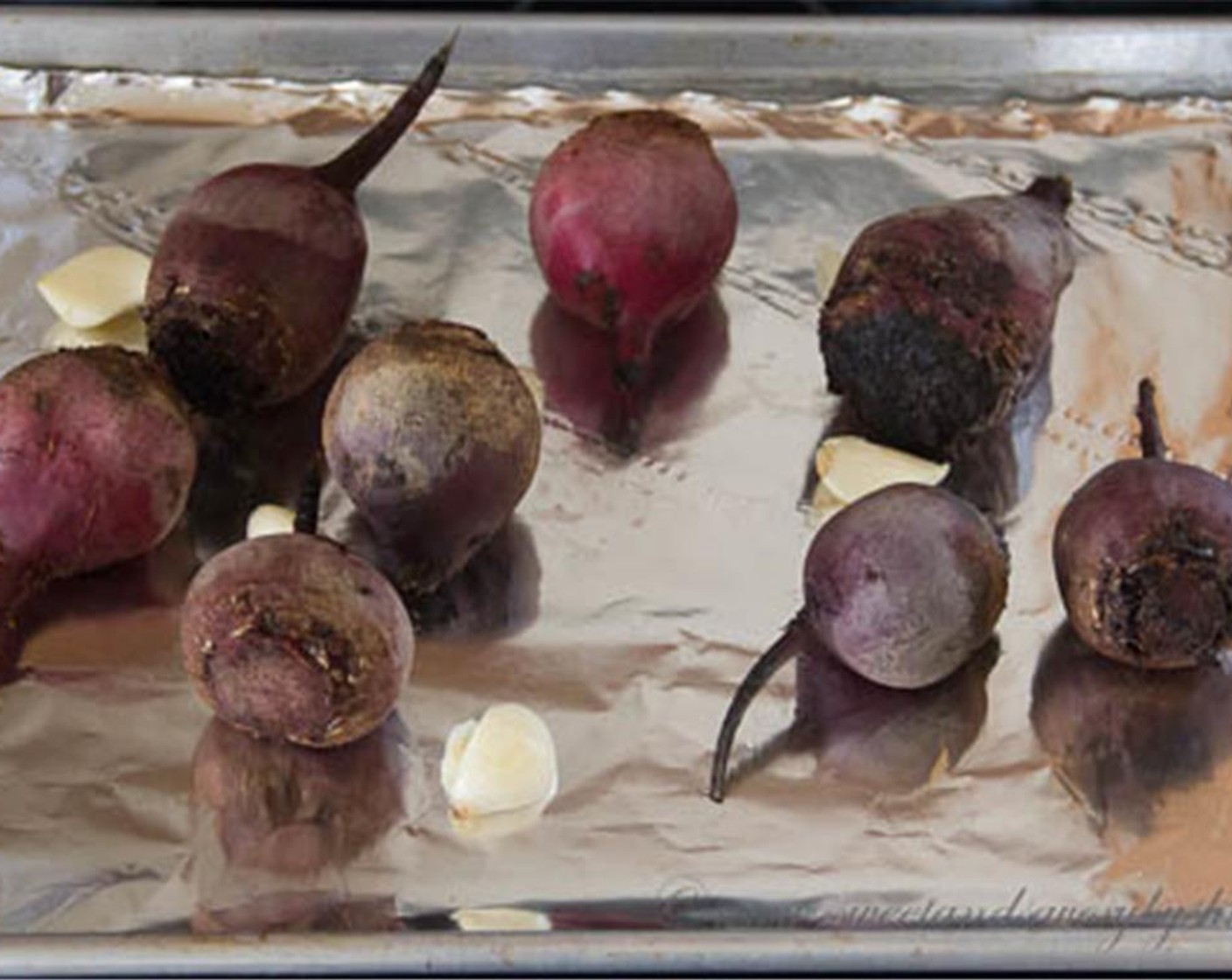 step 2 Place the Beets (7) and Garlic (3 cloves) on greased baking sheet. Roast the beets for about an hour, or until fork-tender.