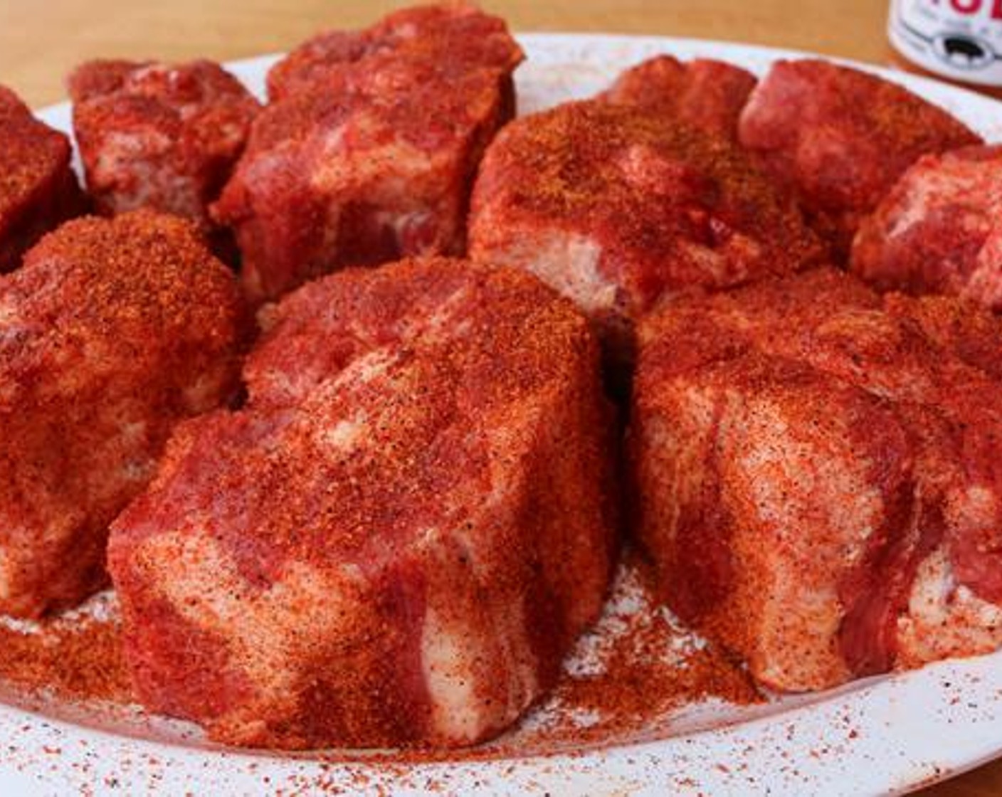 step 6 Trim excess fat from outer edges of Oxtails (4 lb) and season all sides with Barbecue Rub (1/4 cup).
