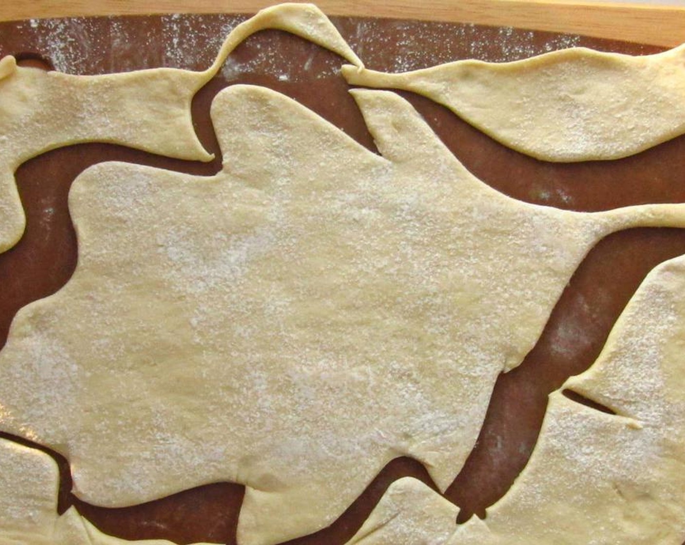 step 2 Lightly dust a cutting board with All-Purpose Flour (to taste). Cut a leaf shape out of the Puff Pastry (1 sheet) using a knife or pizza wheel.