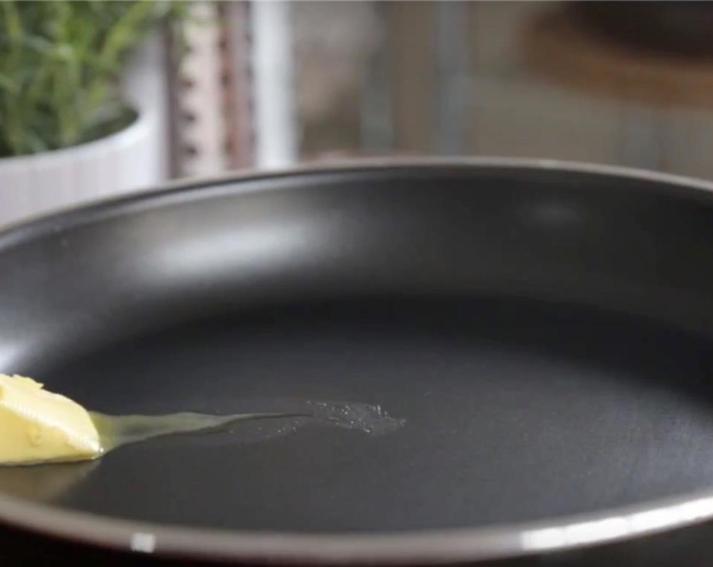 step 2 Heat a small non-stick skillet  over medium. Slide in half of Unsalted Butter (1/2 Tbsp)