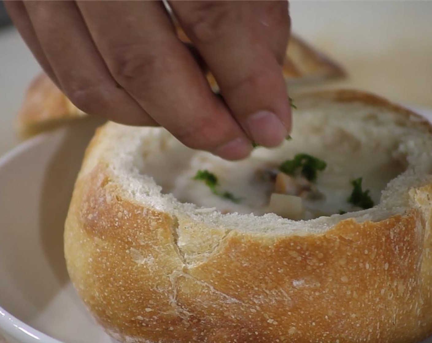 step 4 Ladle soup into the bread bowl. Finely chop some Fresh Parsley (to taste) and/or Fresh Chives (to taste) for garnish.