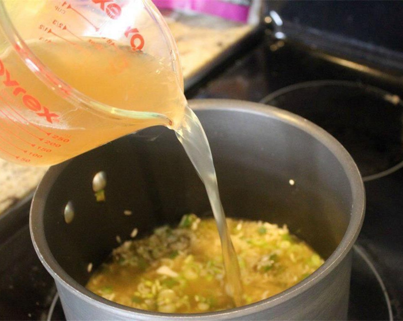 step 7 Now, onto the Chicken Stock (2 cups). I like chicken stock in this -  but vegetable stock or water would work just fine! Follow the instructions for cooking the rice and add that amount of liquid.