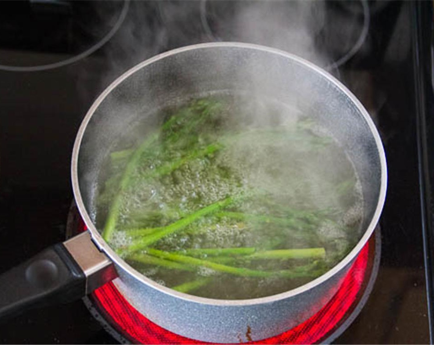step 4 Bring a pot of water to boil. Wash the Asparagus (3/4 cup) and cut 1-2 inches off the end. Blanch them in boiling water for 3 minutes. Cut into 2-inch pieces.