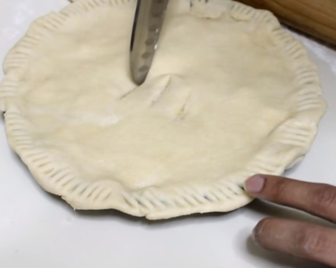 step 7 On a floured surface, roll our your dough. The fill in the pie dish with the filling mixture, and smoothly cover the surface by the flat dough. Make sure to tug in the edges. Have some vent holes at the center, and bake under 400 degrees F (200 degrees C) for about 40 minutes.