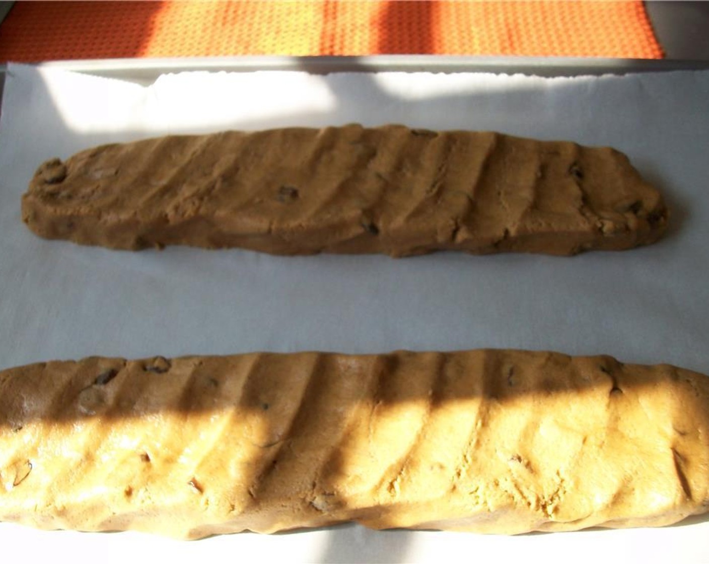 step 6 Divide dough into two equal pieces and shape each into a 12-inch log placed 3 inches apart on the parchment lined baking sheet. Bake until golden brown and still soft to the touch, about 20-22 minutes.