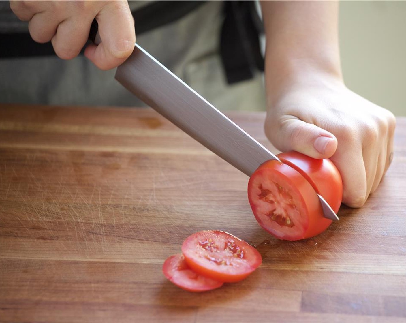 step 2 Cut the ends off the Chinese Eggplant (1) and discard. Slice the eggplant into half inch thick rounds, and set aside. Slice the Roma Tomatoes (2) into half inch thick rounds. Peel and cut Onion (1) into quarters, and set into a medium bowl.