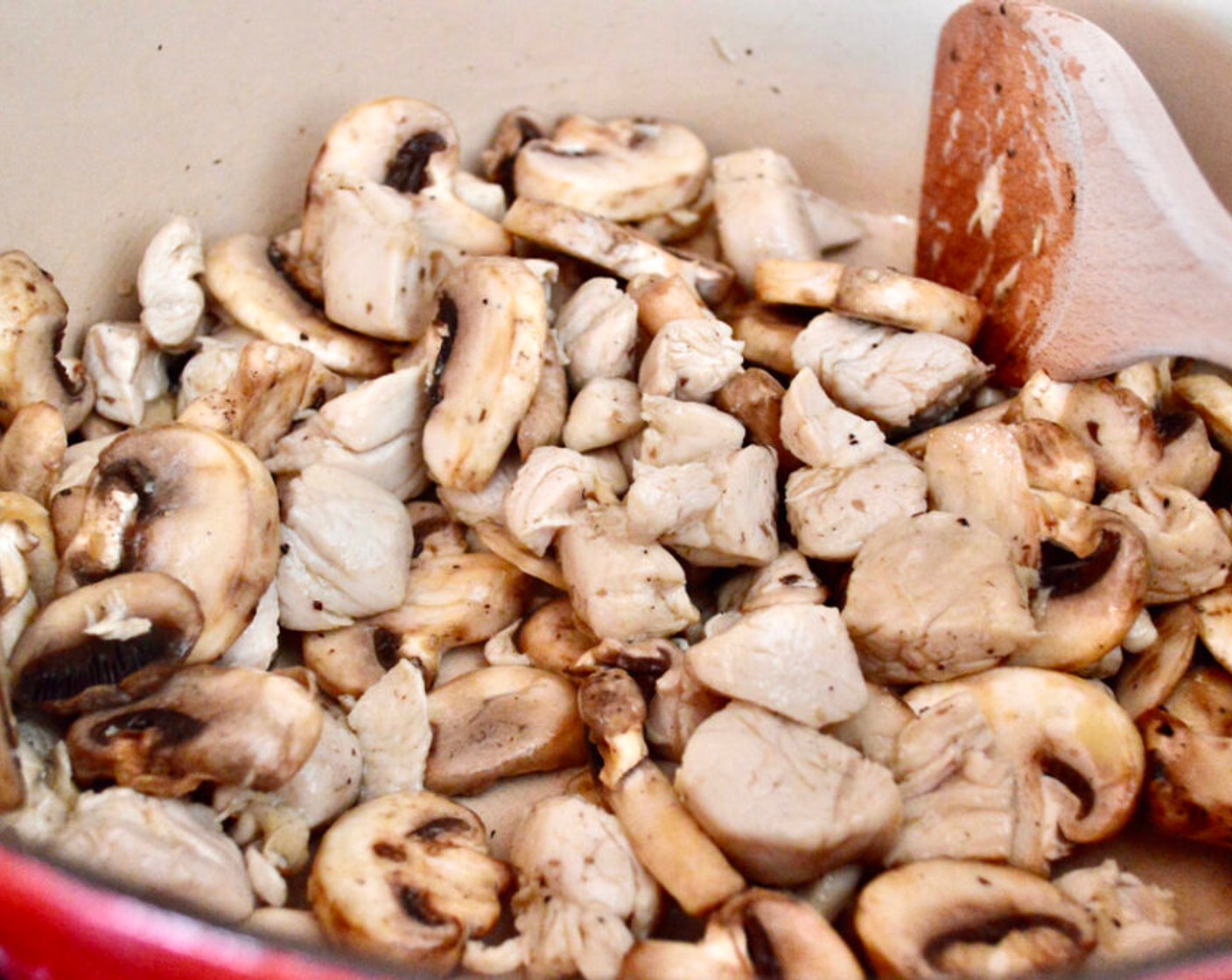 step 2 Add White Mushrooms (2 1/3 cups) and let them get soft and tender while stirring with the chicken. Season generously Salt (to taste) and Ground Black Pepper (to taste).