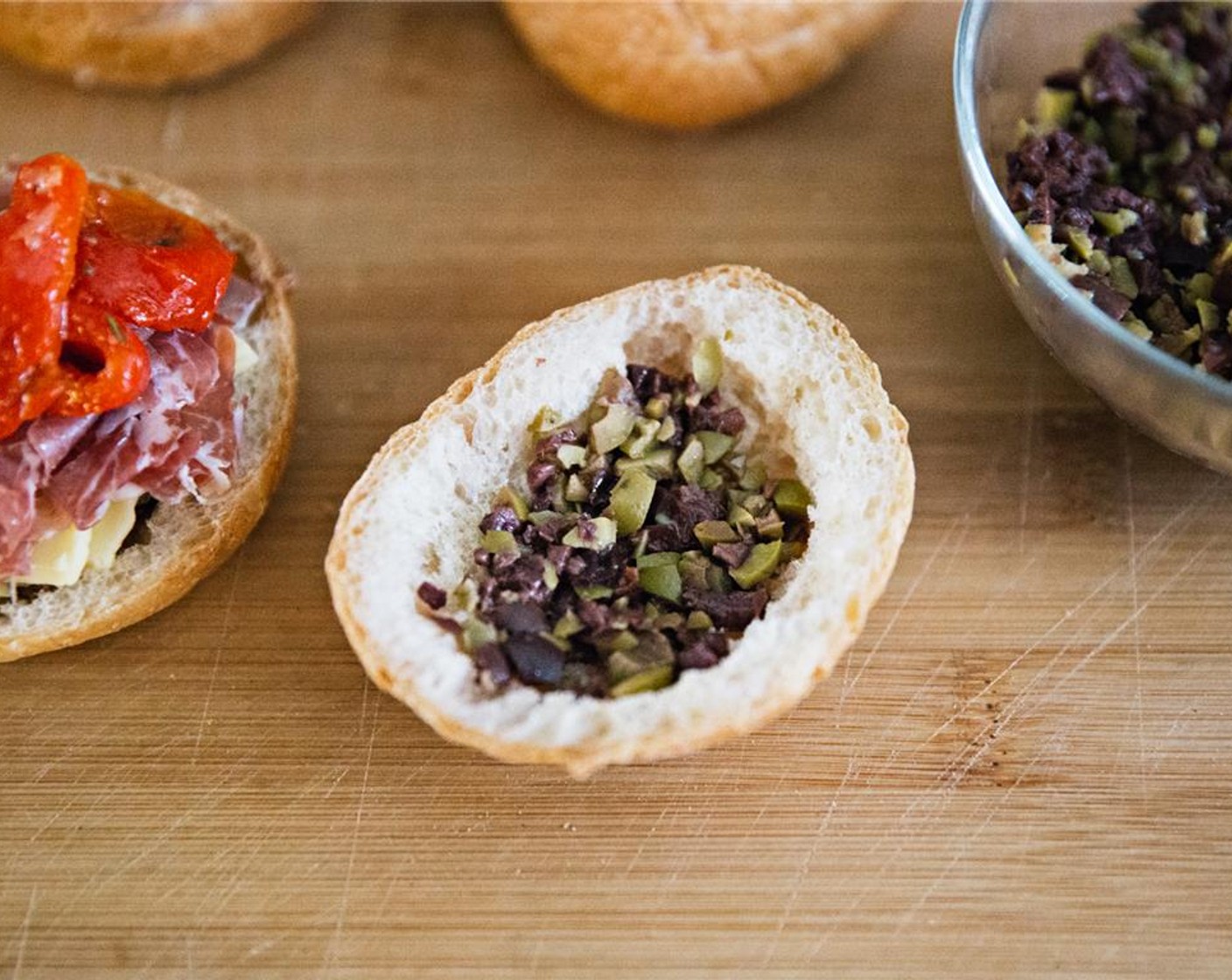 step 11 Spread the top half of the boule with chopped olives.