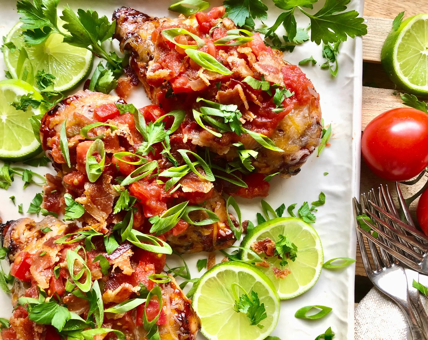 step 6 When ready to serve, top each breast with about 1/4 cup of Salsa (3/4 cup) and sprinkle with Thick-Cut Bacon (4 slices) and Scallions (4 Tbsp). Add some Fresh Parsley (to taste) for garnish, if desired. Serve with Lime Wedges (to taste).