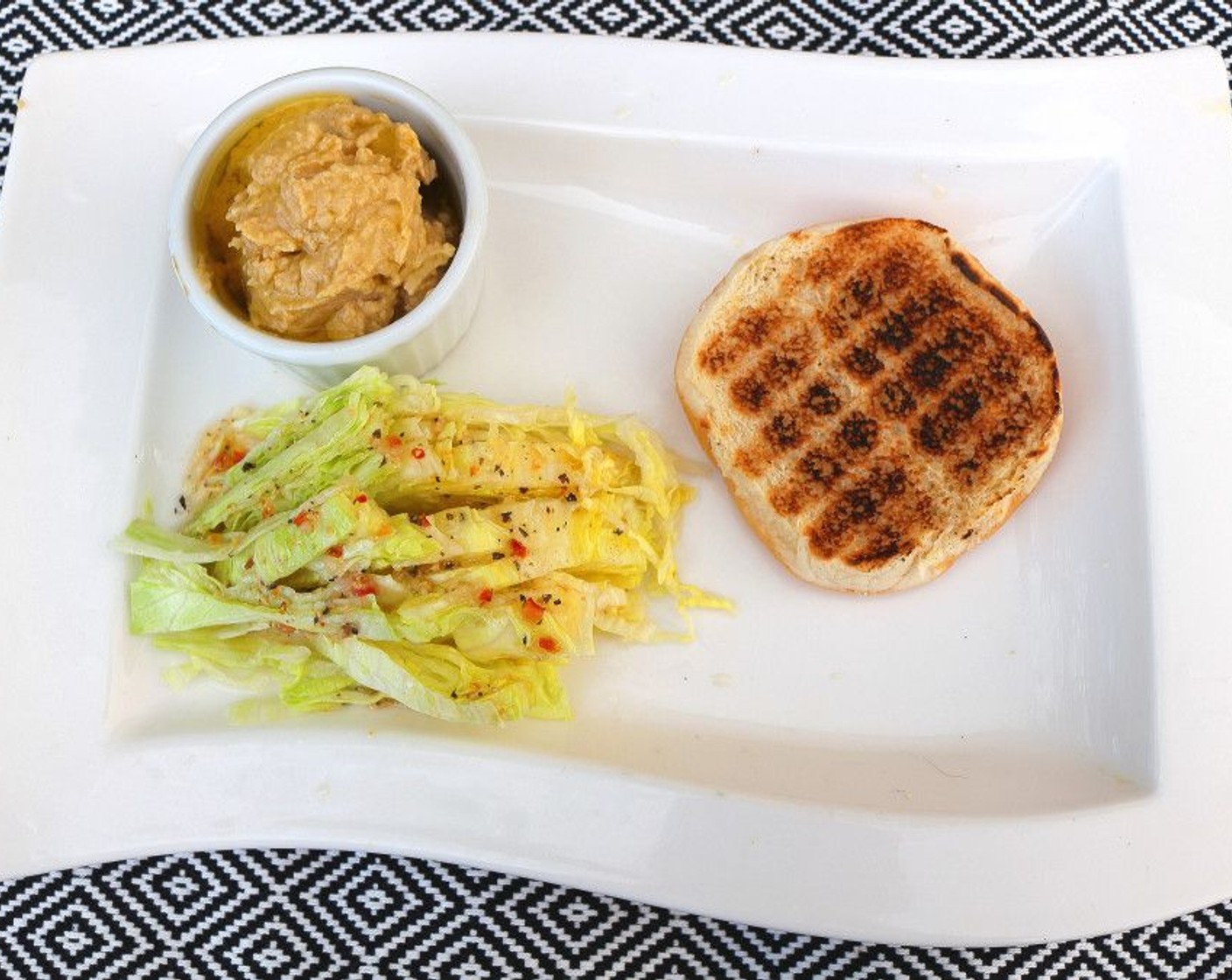 step 10 Plate Lettuce (to taste), Hummus (to taste) and bottom-half of bun.