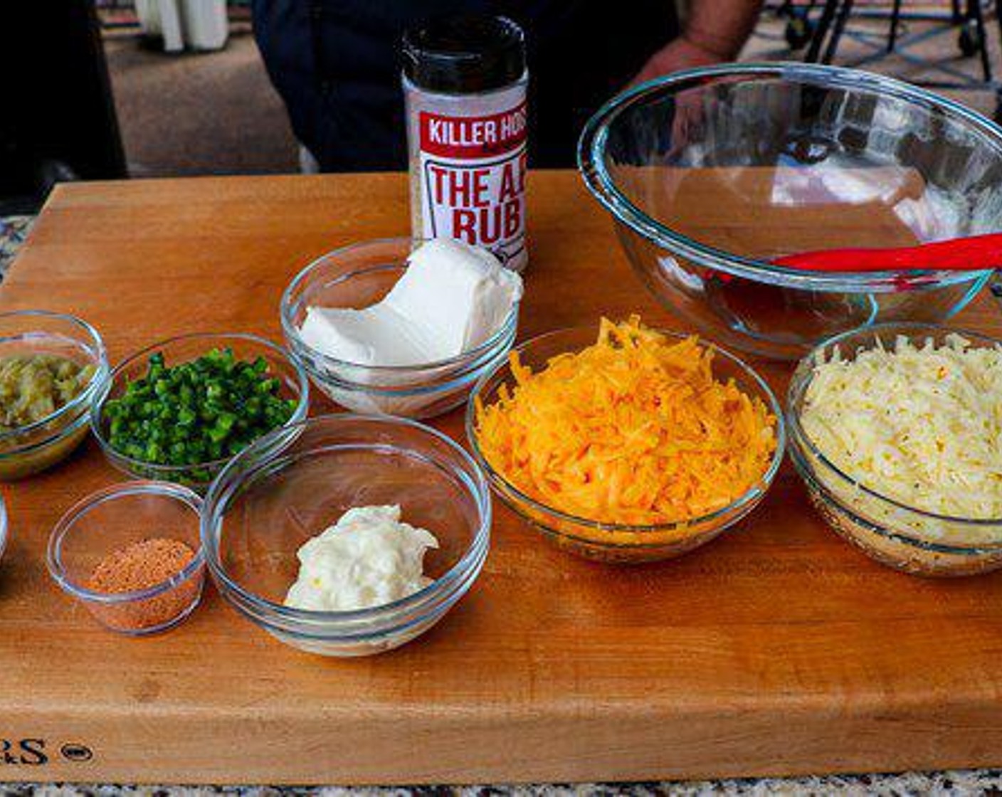 step 5 Combine Cream Cheese (1 cup), shredded pepper jack, shredded sharp cheddar, Mayonnaise (1/3 cup), Canned Mild Diced Green Chiles (1/2 cup), diced jalapeños, All-Purpose Spice Rub (1/2 Tbsp) and Mexican Seasoning (1/2 Tbsp) in a large bowl and place in a cast iron skillet.