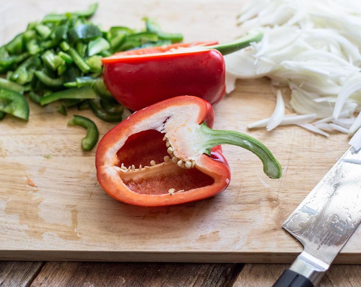 step 2 Add Coconut Oil (1/2 Tbsp), Bell Peppers (1 1/2), Onion (1) and Garlic (2 cloves) to a medium-large nonstick skillet. Cook on medium heat, stirring occassionally until onions and peppers begin to brown on the edges. Add Chili Powder (1 tsp) and Ground Cumin (1 tsp) stir to combine, then remove from pan and set aside.