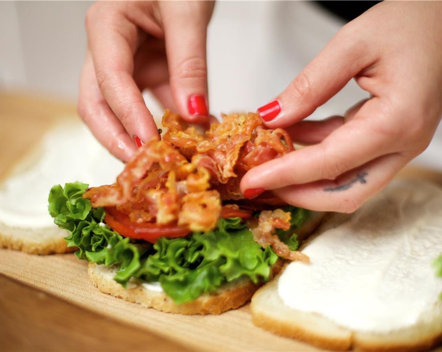 step 13 Take 2 leaves from the Escarole Lettuce (1) and top each one with a leaf, several tomato slices, and an equal amount of pancetta. Place the remaining slices with the mayonnaise mixture on top.