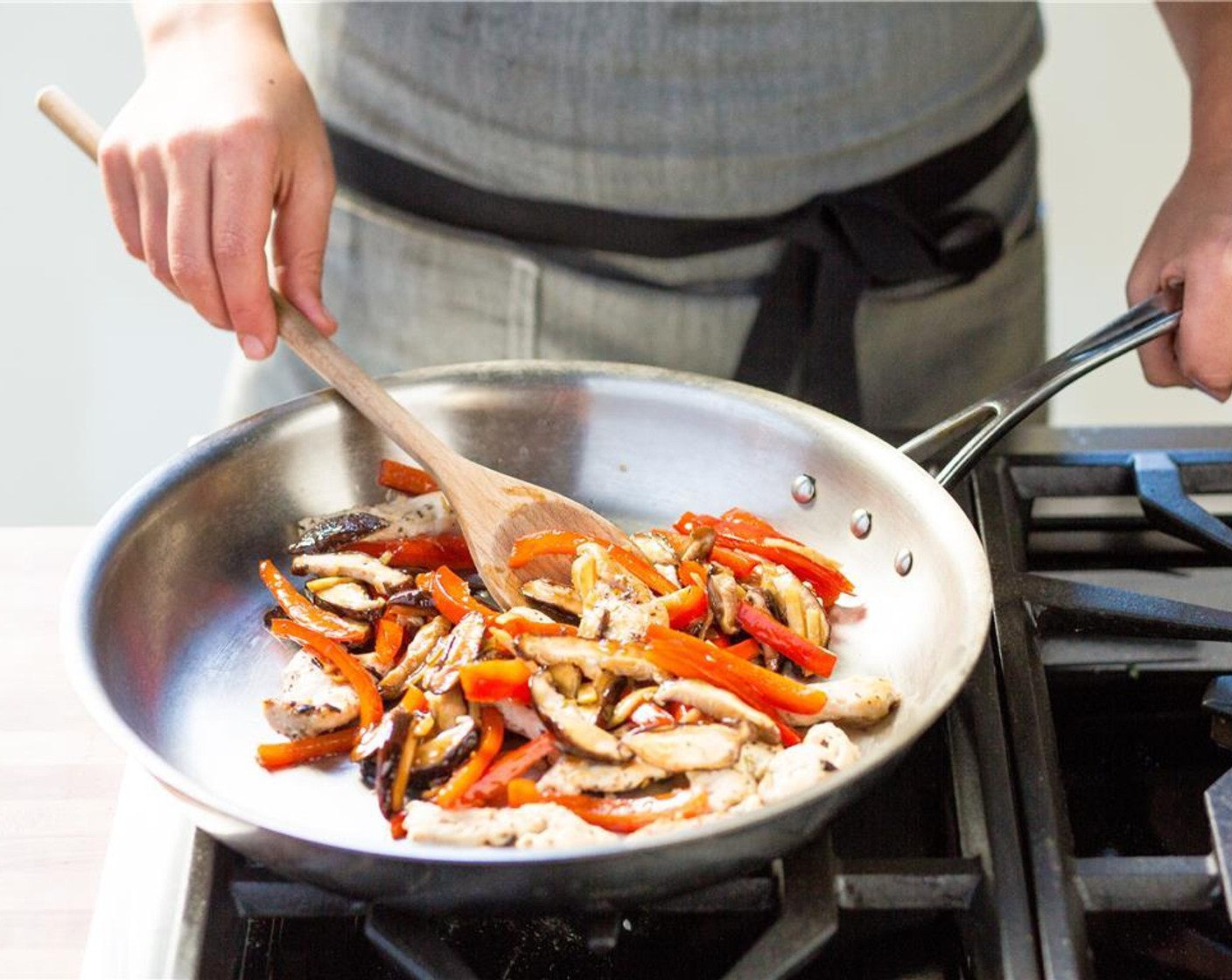 step 13 Add the Fish Sauce (1/2 Tbsp), Oyster Sauce (1/2 Tbsp), Granulated Sugar (2 Tbsp), ginger, mushrooms, red bell pepper. Cook for five minutes or until the vegetables are tender and the chicken is cooked through.