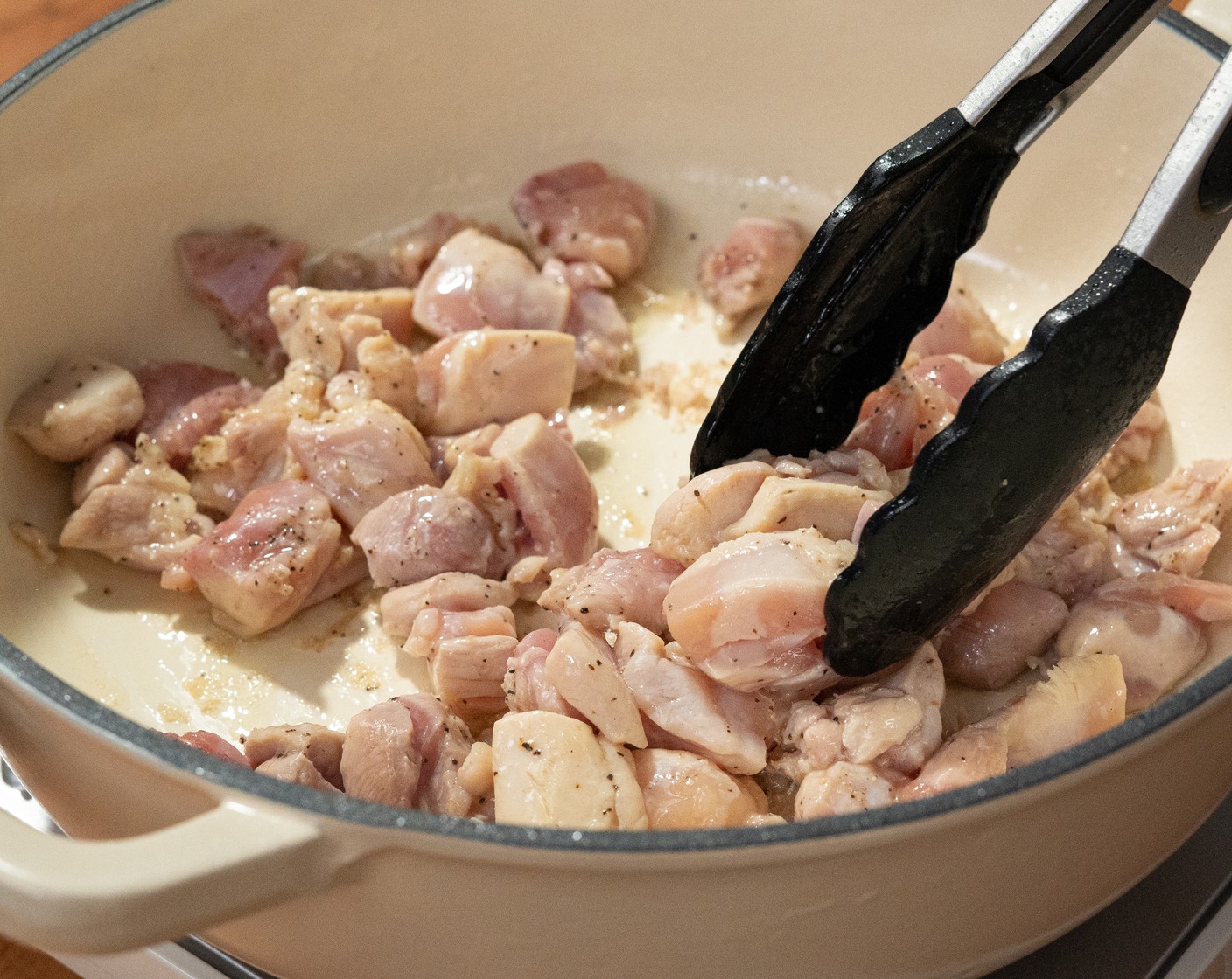 step 2 Heat the Olive Oil (2 Tbsp) in the dutch oven over medium-high heat. Once hot, add chicken and sear the chicken for about 5 minutes or until golden brown. Remove from the pot, and set aside.