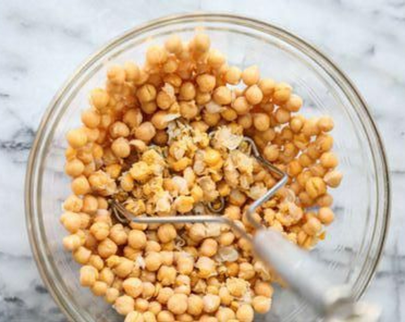 step 1 In a large bowl, using a potato masher or large whisk, coarsely smash most of the Chickpeas (2 cans).