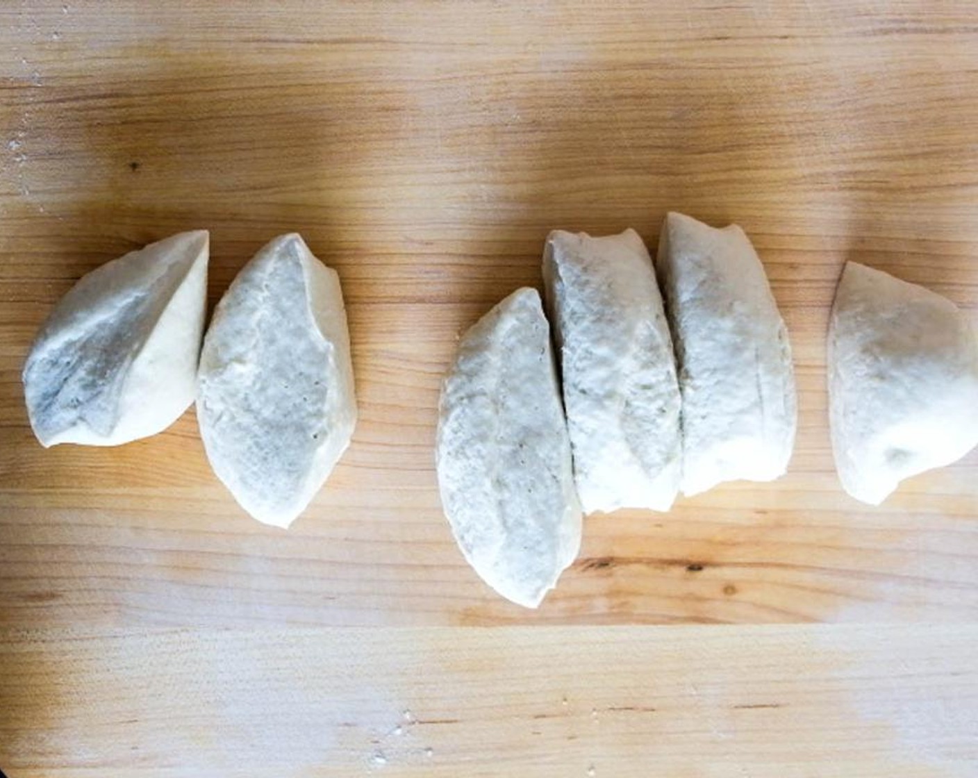 step 6 Divide the dough into 6 equal portions and roll each portion into a smooth ball. Working on 1 piece at a time, keeping the other portions covered so that they do not dry out.